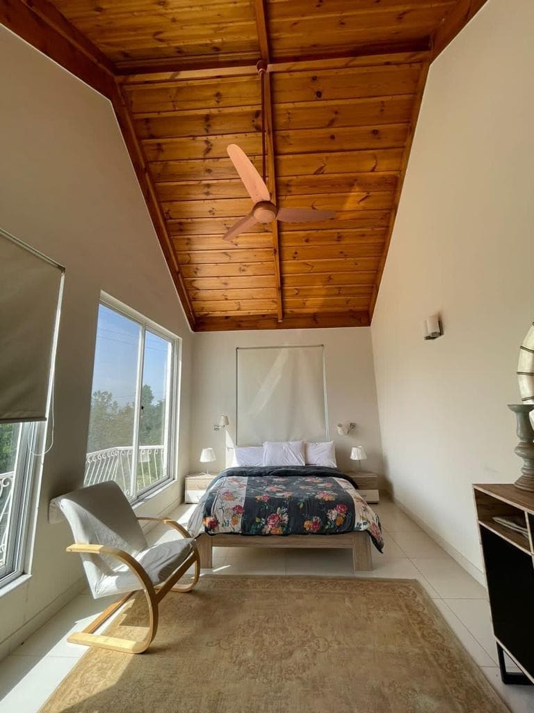 Master suite with pine-timber ceiling